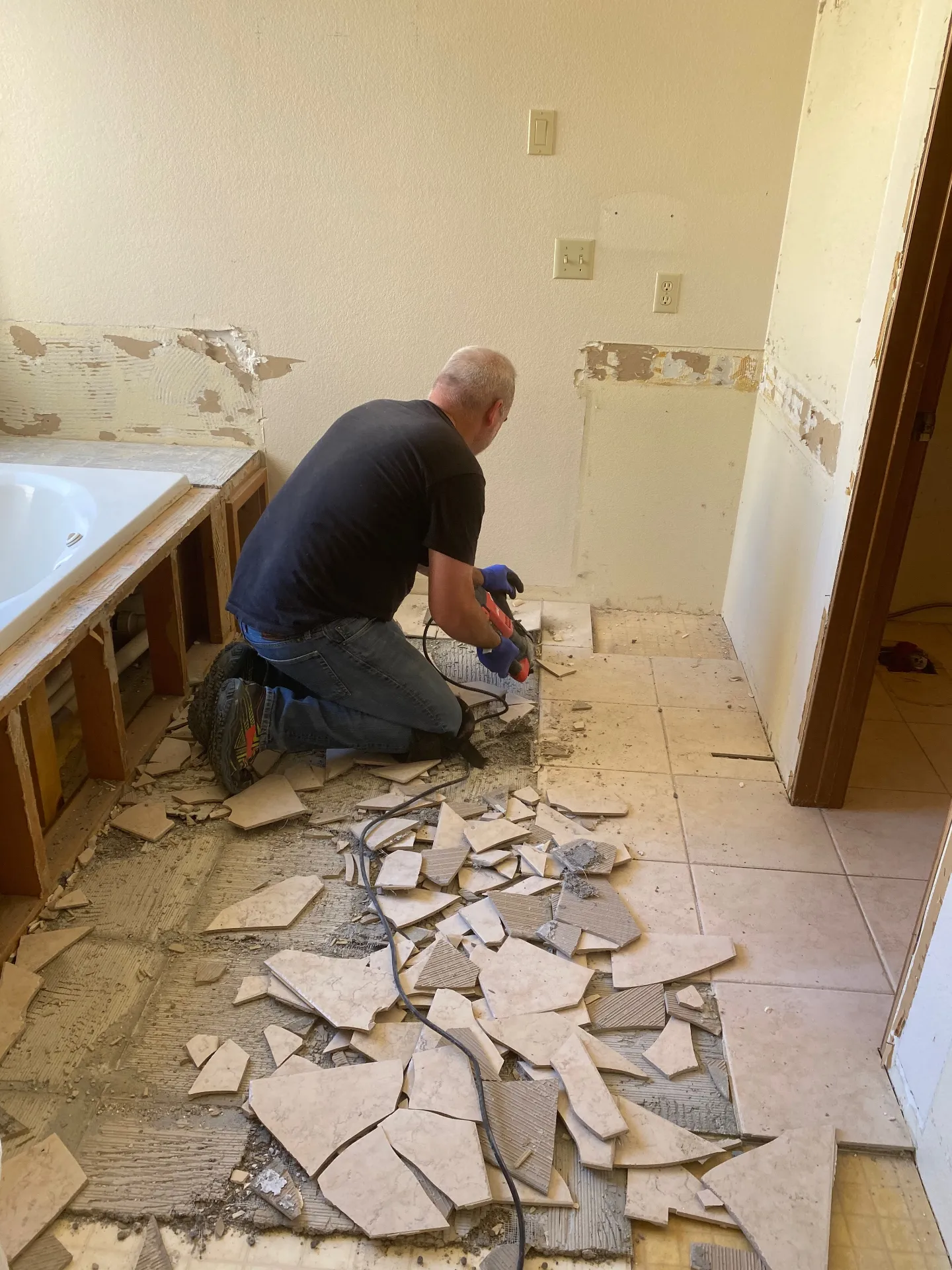 Floor tile removal in progress