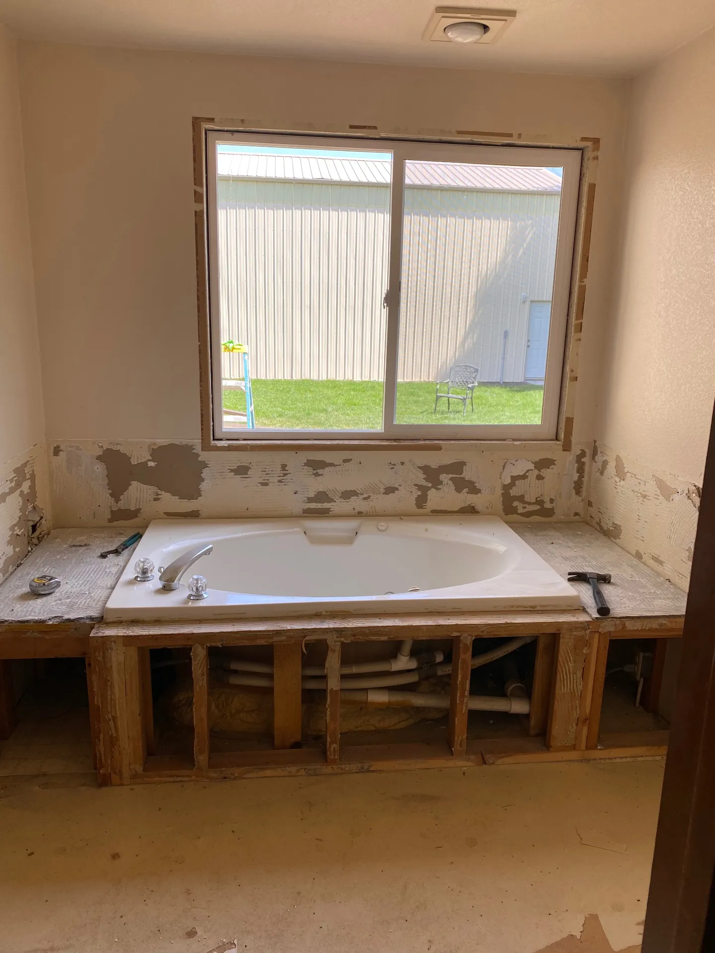 Bathtub area during demolition - tile removed
