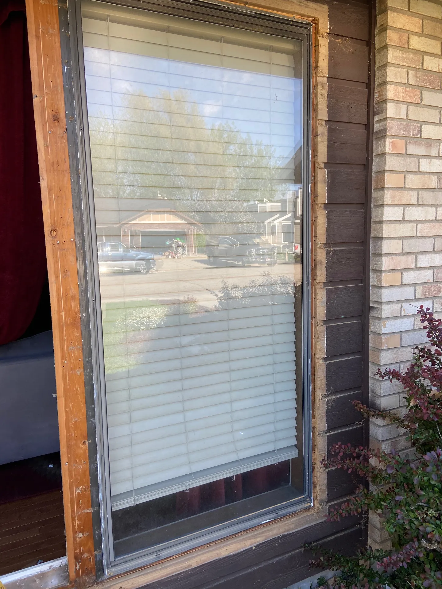 Window during replacement showing exposed framing